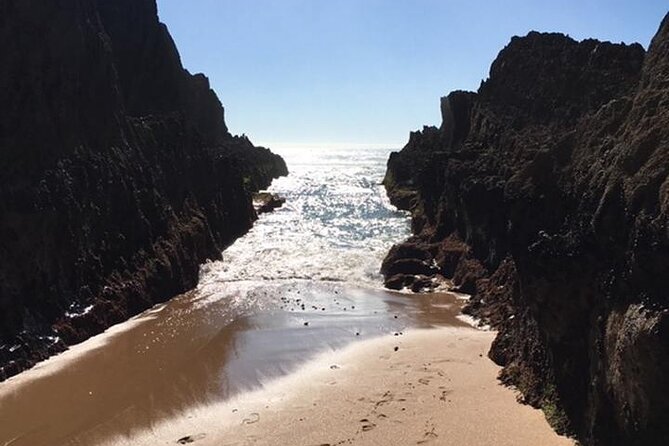 Beaches and Monuments ECAR GPS/Audioguide EN ES FR IT DE DU - Praia Grande: Saltwater Pools, Surfers, and Dinosaur Footprints