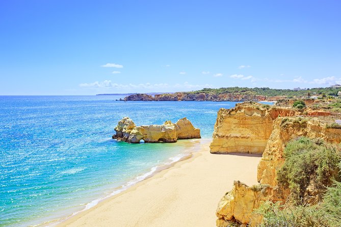 From Lisbon: Algarve Private Tour to Portimao, Lagos and Sagres - Praia da Marinha: crystal-clear water and cliff drama